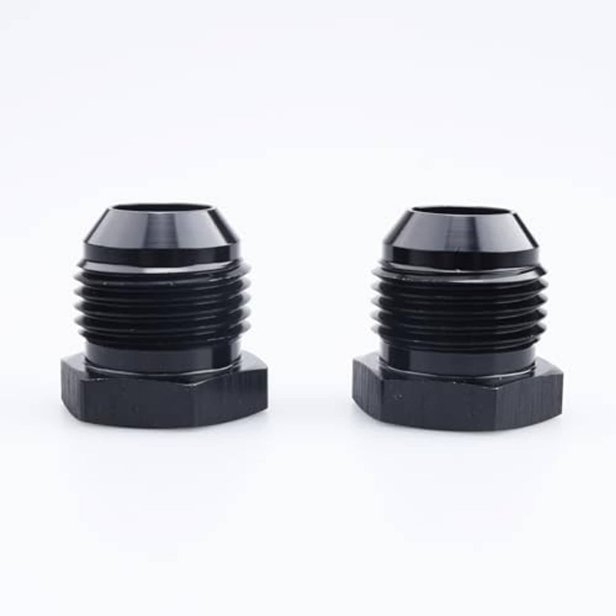 Black AN male flare blanking plug connectors front view, hex cap base and ridged threads