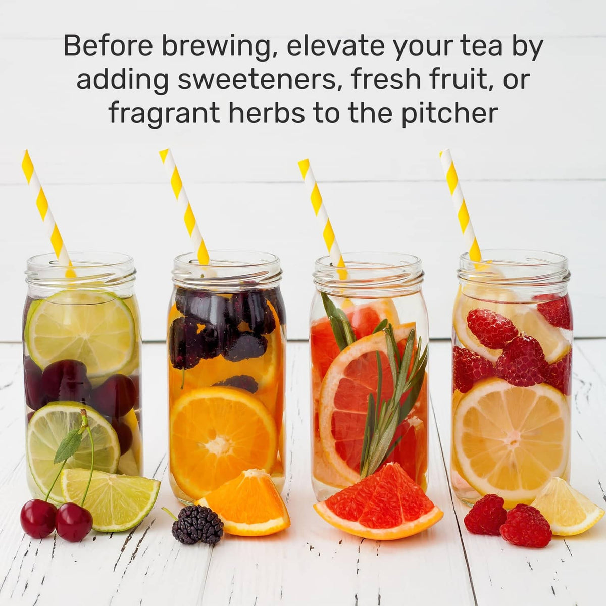 Assorted fruit-filled iced tea jars with herb garnish lined on a table