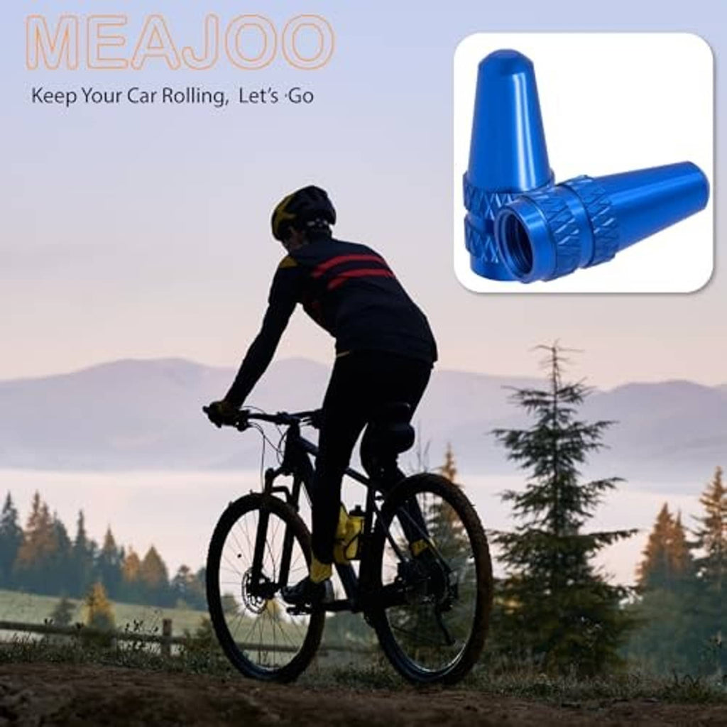 Blue Presta valve caps inset on a bike, tapered textured dust covers