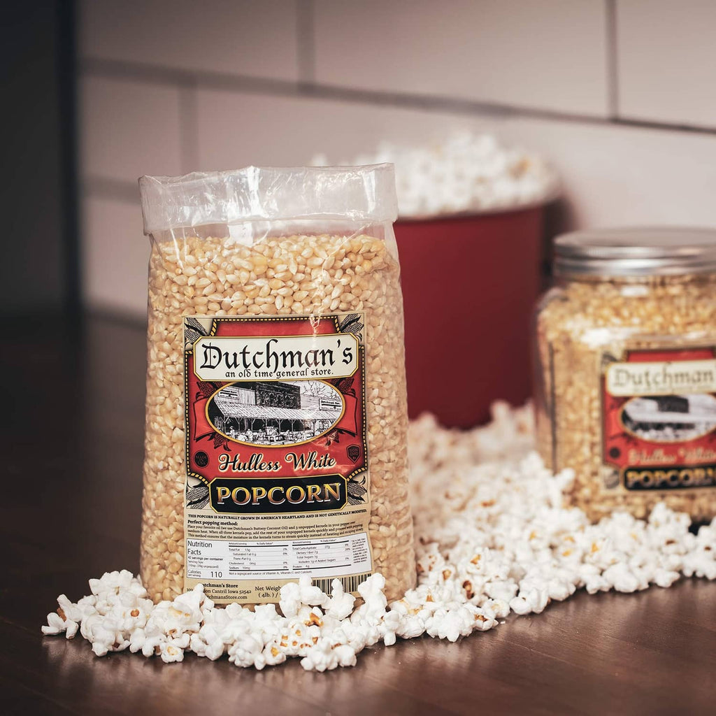 Dutchman's Hulless White popcorn kernels bag with loose kernels beside it
