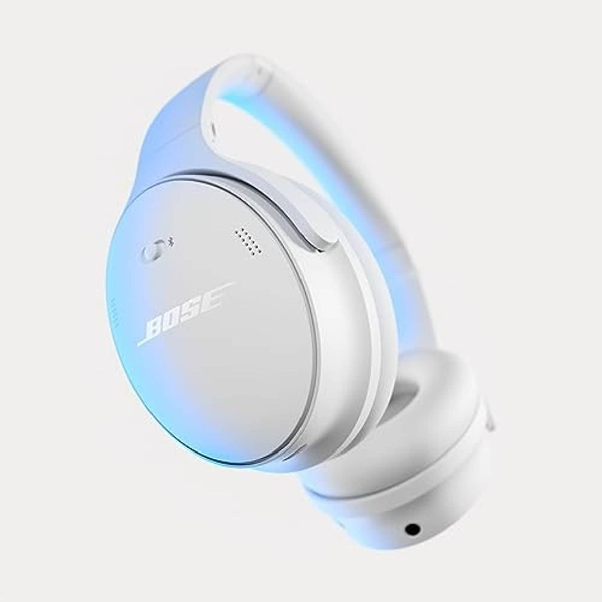 White smoke over-ear headphones with blue light ring on ear cup
