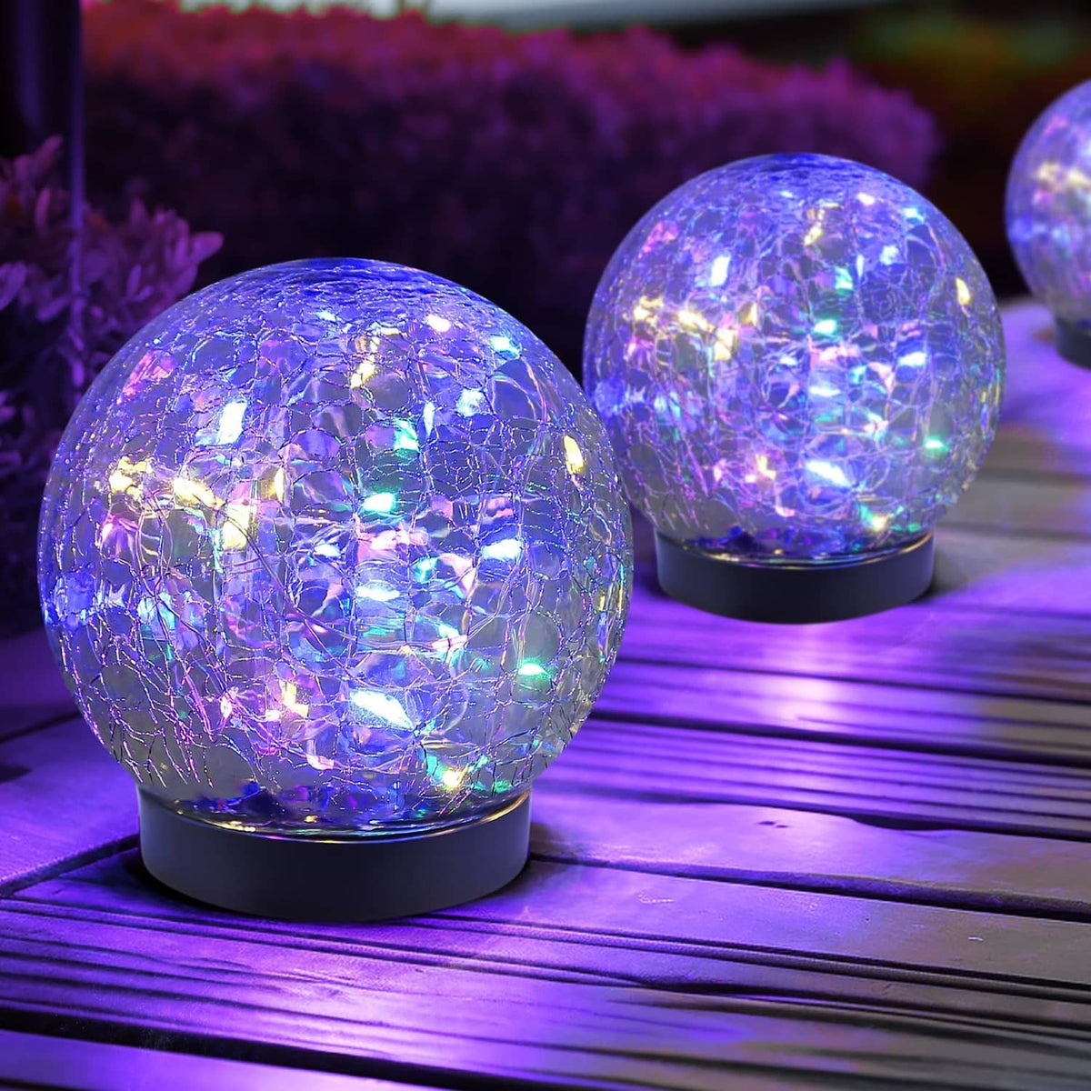 Solar glass globe lights, two blue-purple glowing spheres on black bases