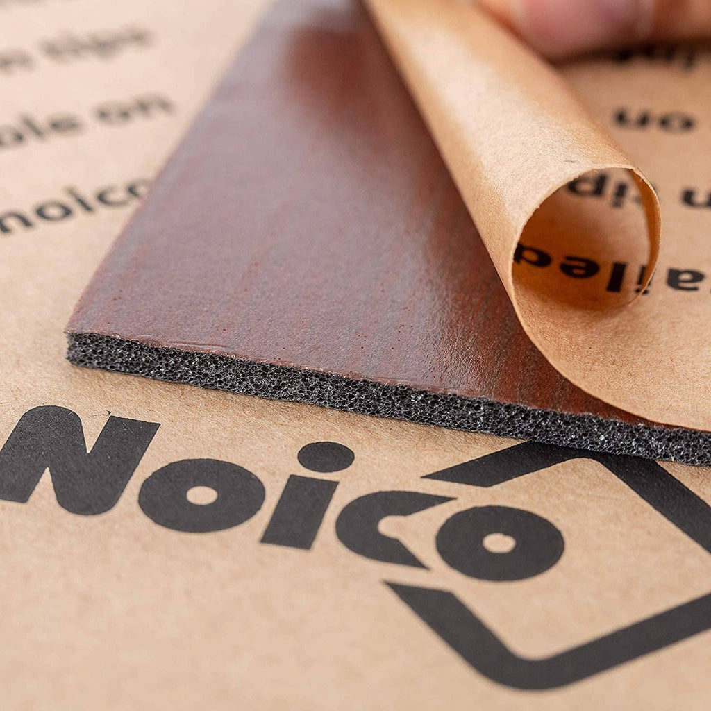 Rolled sound insulation liner with dark gray foam layer and brown self-adhesive backing