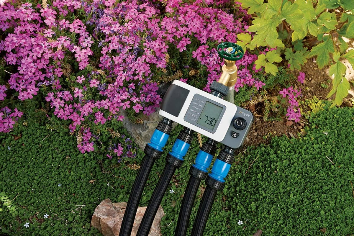 Gray 4-port smart hose watering timer with LCD display and four connected hose lines