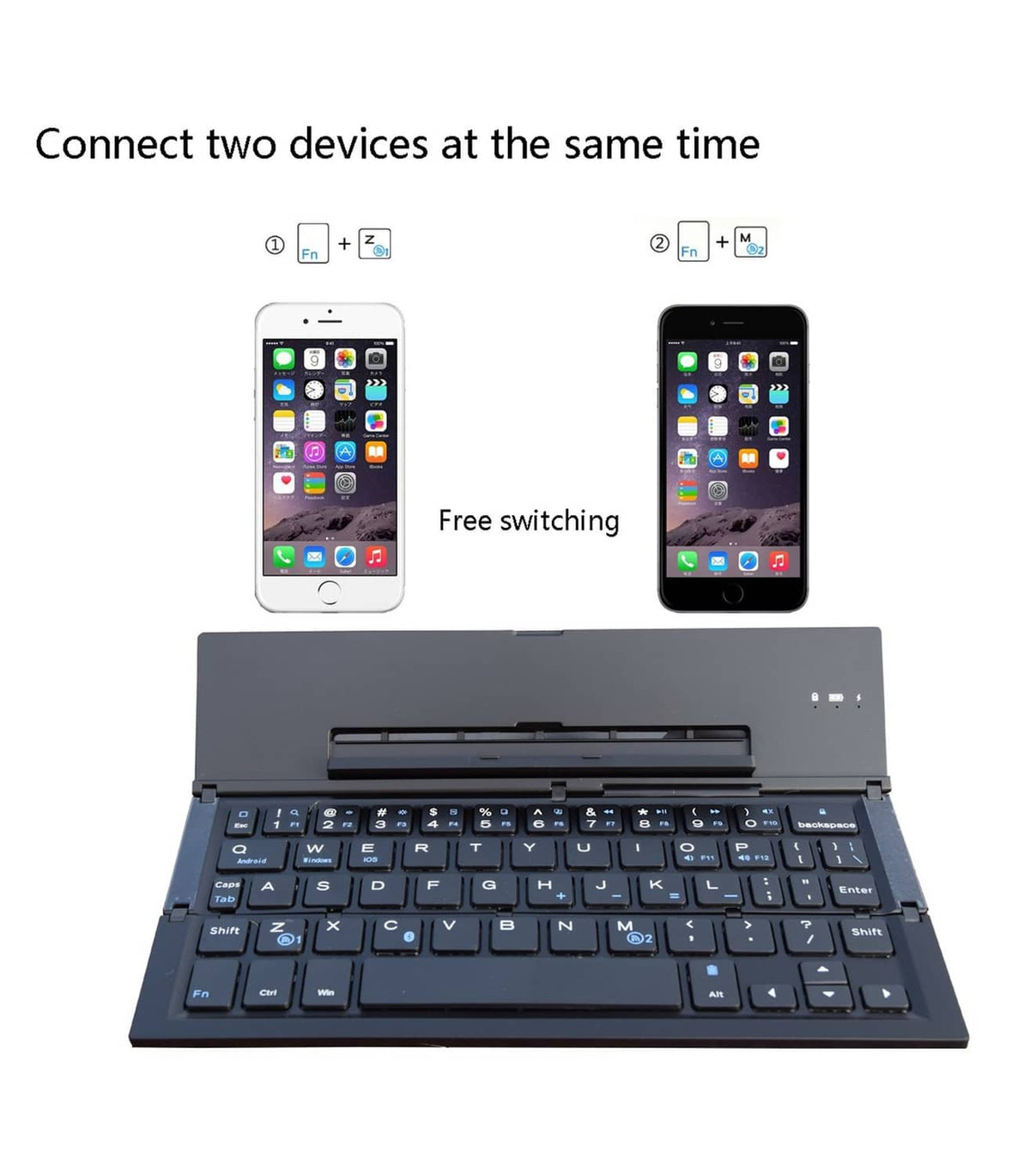 Foldable Bluetooth keyboard with compact layout beside two smartphones.