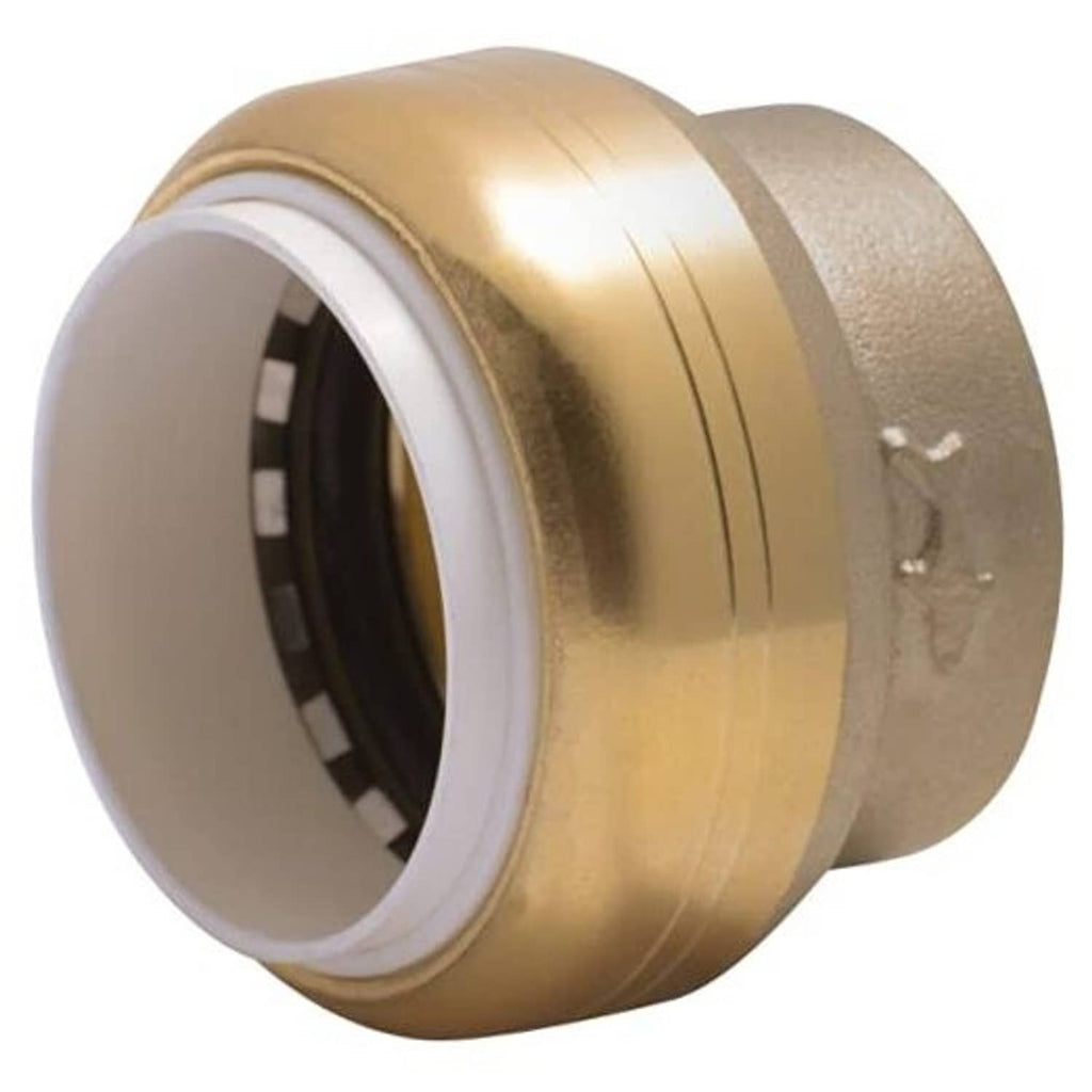 Brass push-to-connect PVC cap fitting with white inner sealing ring, 1-inch size