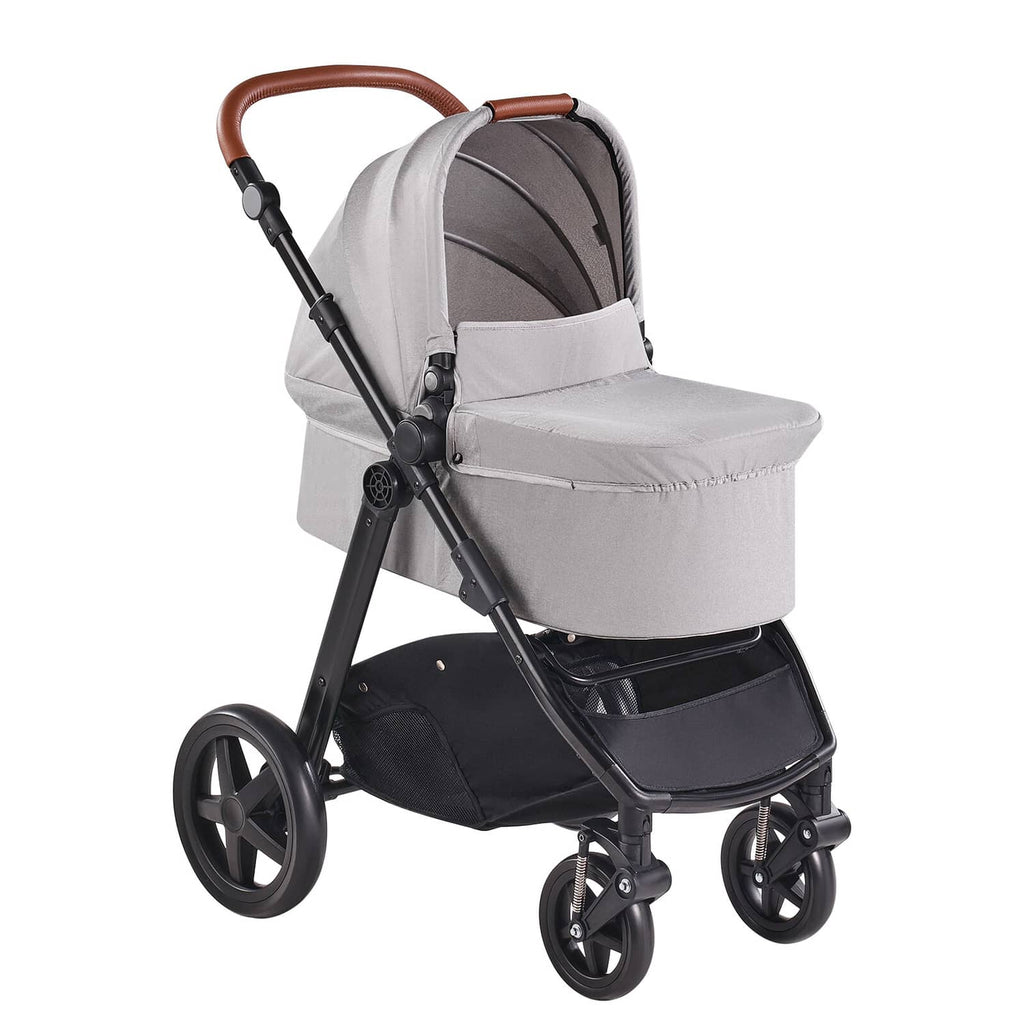 Light gray stroller travel system with bassinet, arched handle and black wheels