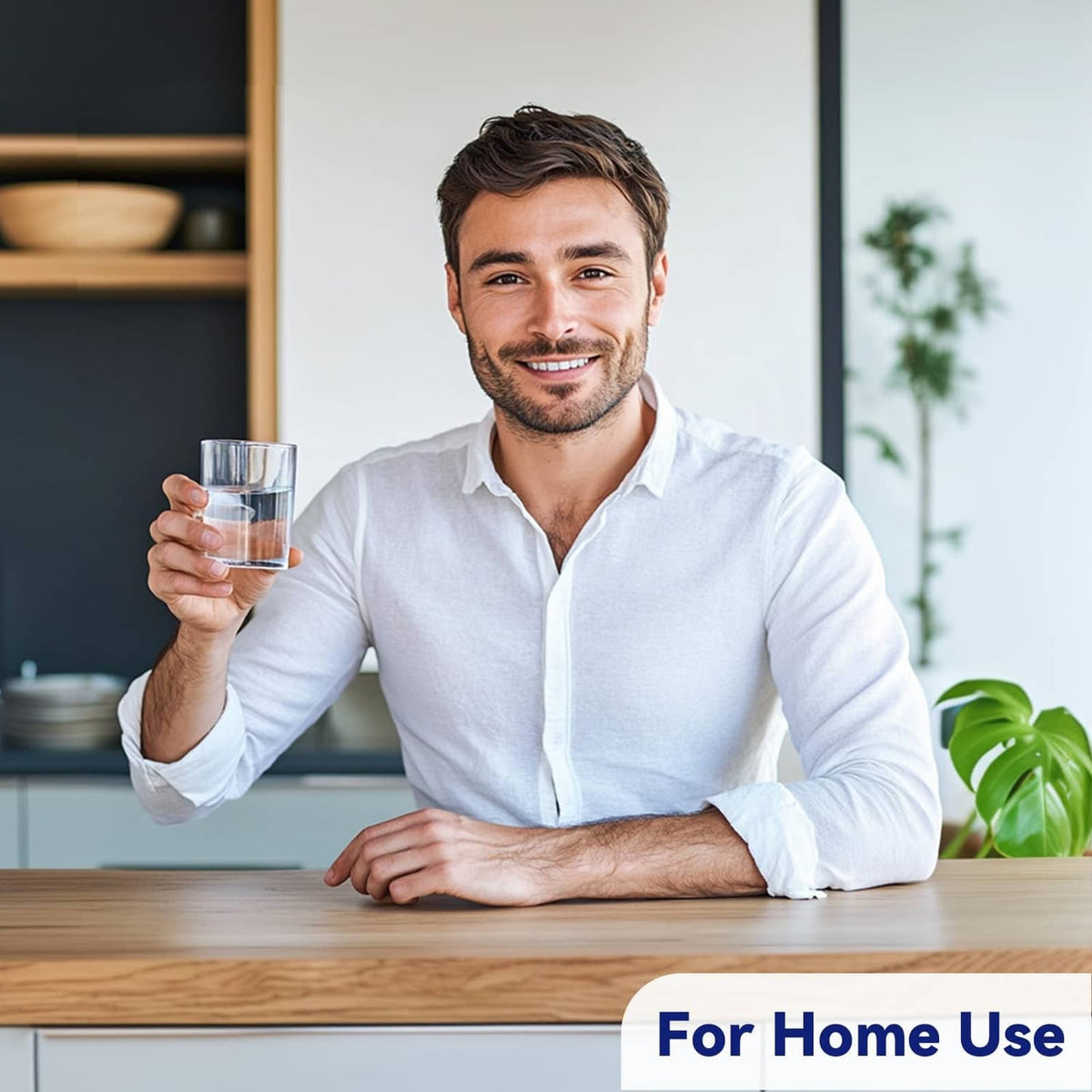 Man at home holding a glass while preparing medication