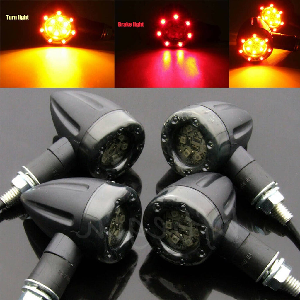 4 motorcycle LED signal lights, black housings illuminated red and amber for turn/brake