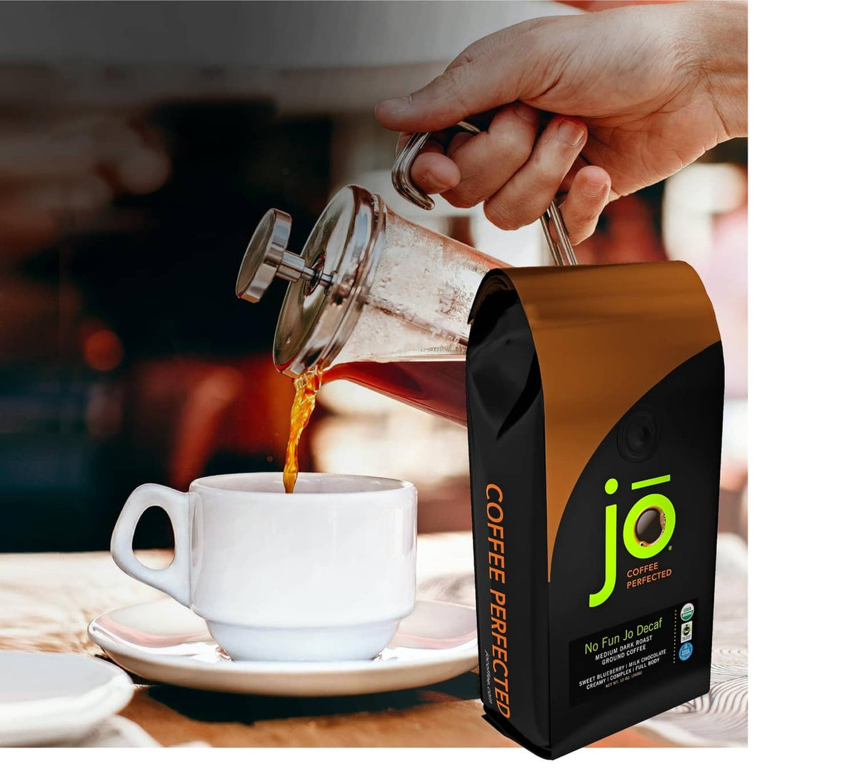 Decaf ground coffee bag with coffee being poured into a white cup