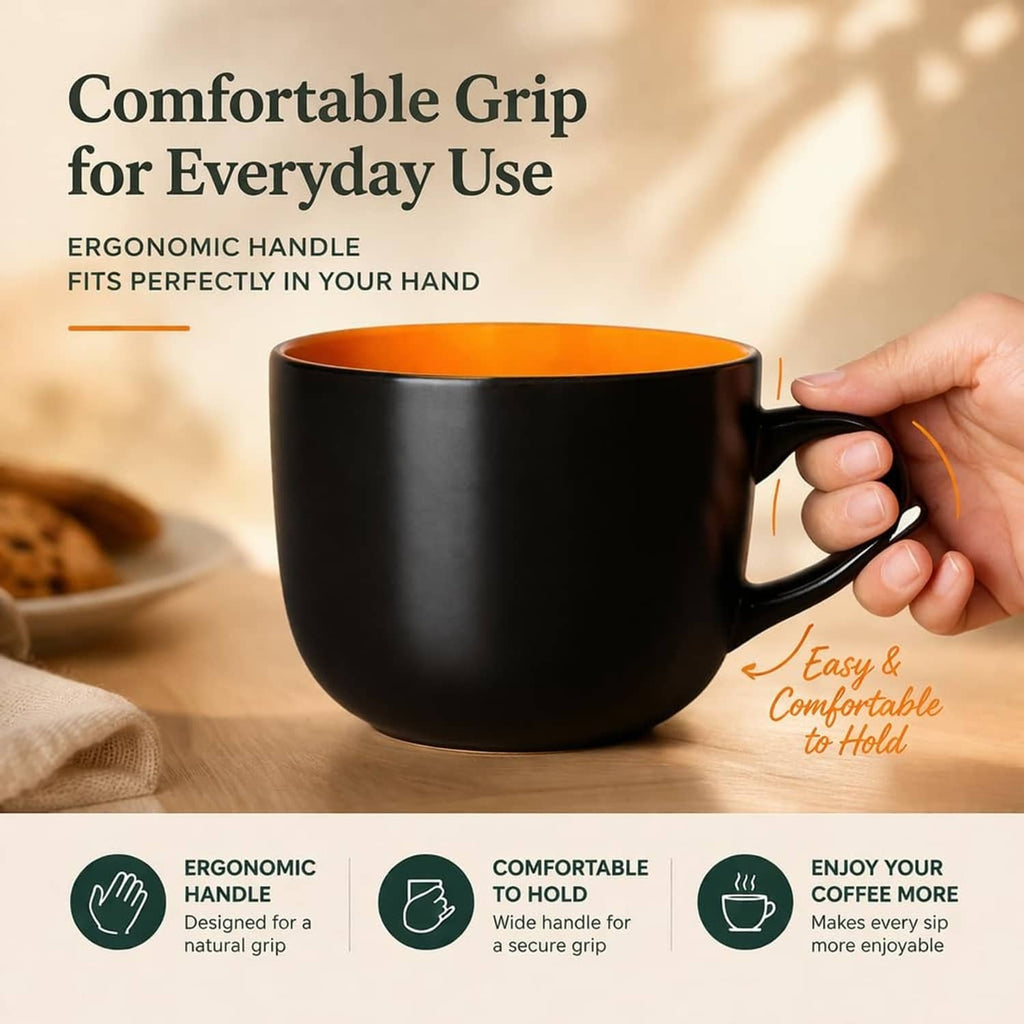Black soup mug with handle and orange interior, ergonomic for comfortable everyday grip