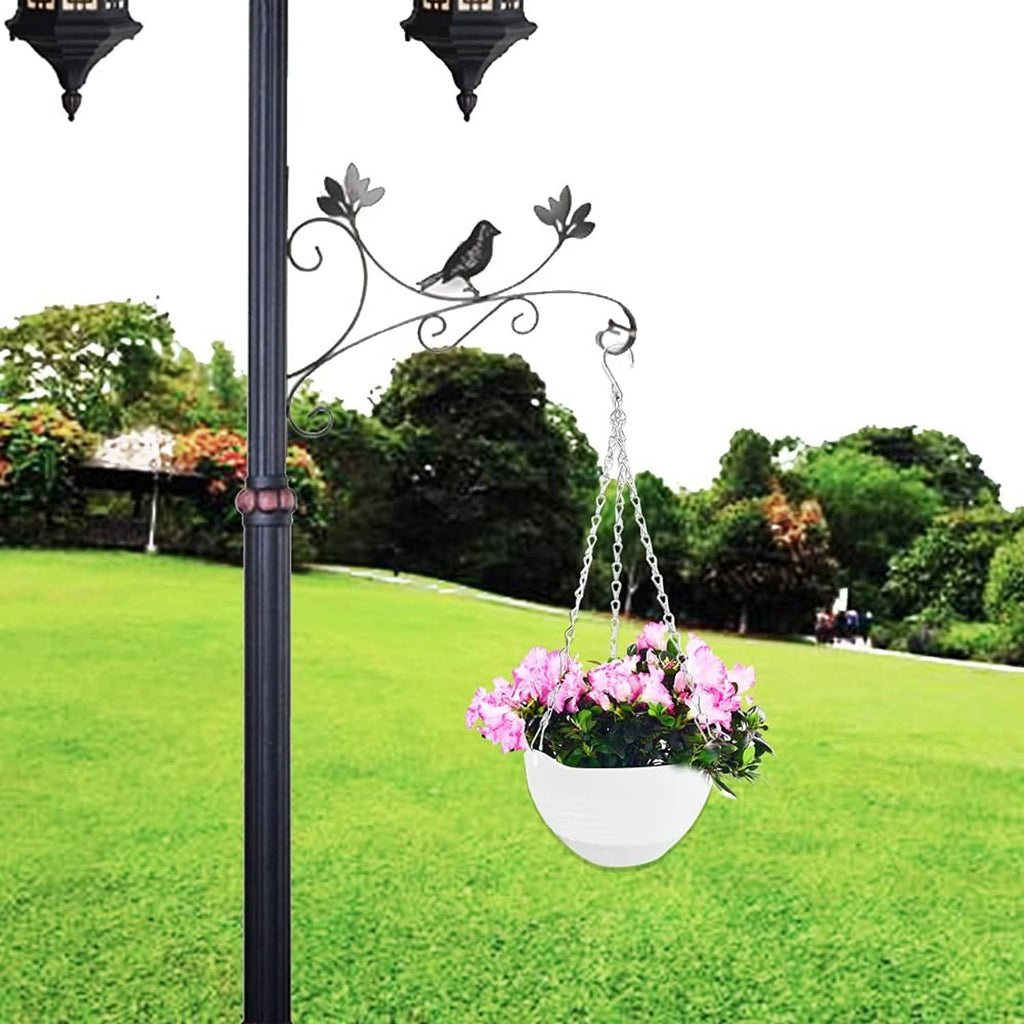 White ribbed hanging planter on metal chain holding purple flowers
