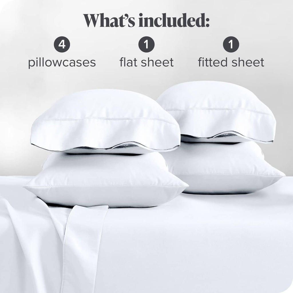 White bed linen pieces showing pillowcases, flat sheet, and fitted sheet