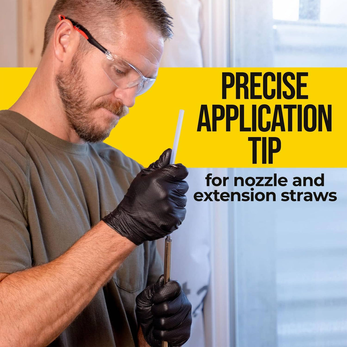 Spray foam gun using extension straw for precise nozzle application, gloved hands