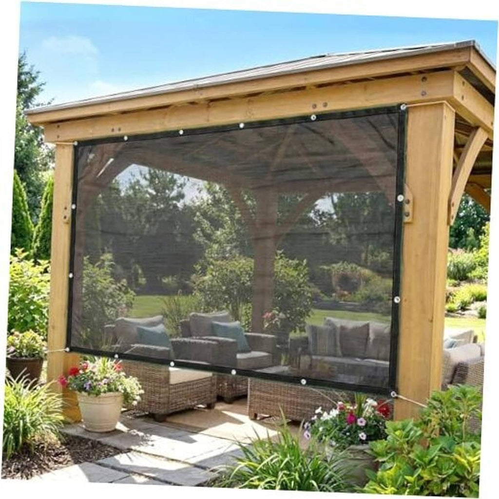 Black HDPE shade cloth panel with metal grommets on a pergola frame