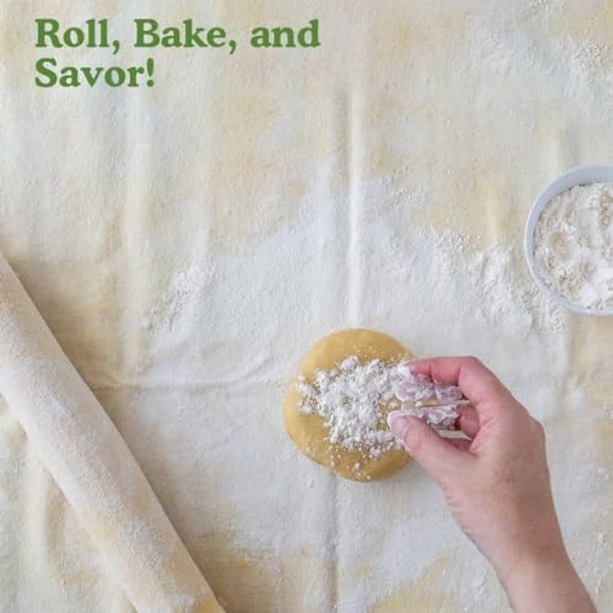 Hand flouring dough on a natural pastry cloth
