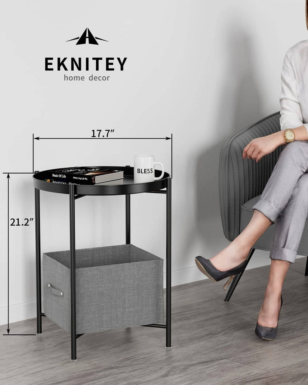 Black metal side table with round top and open lower shelf, with size diagram
