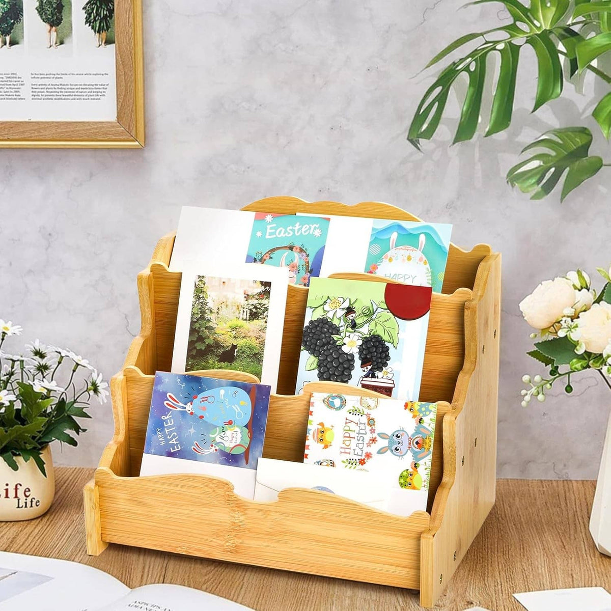 Bamboo 3-tier greeting card holder displaying colorful greeting cards