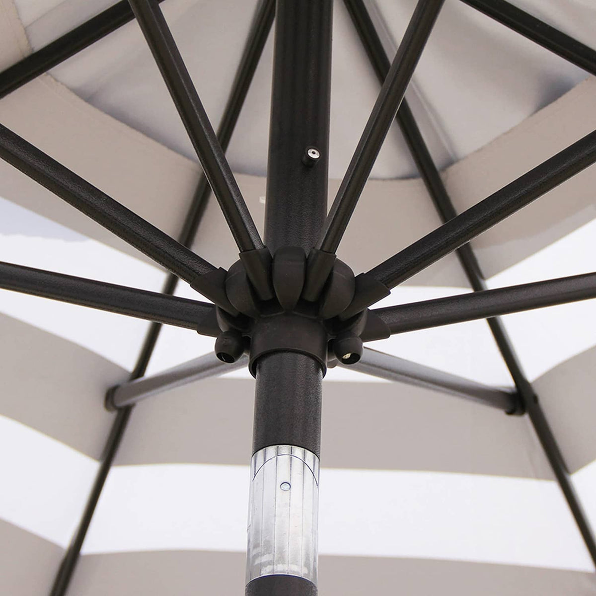 Outdoor umbrella pole hub with black ribs and silver center joint