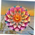 Pink, orange, and teal metal mandala wind spinner with flower center, hanging
