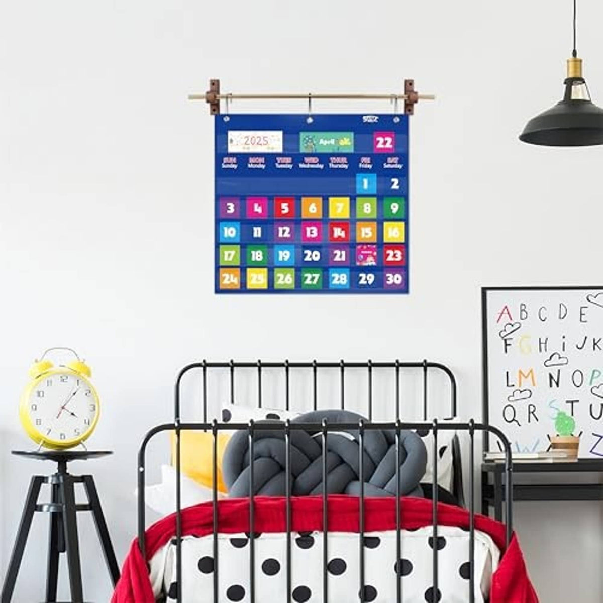 Blue monthly pocket calendar chart with metal grommets and silver hanging hooks