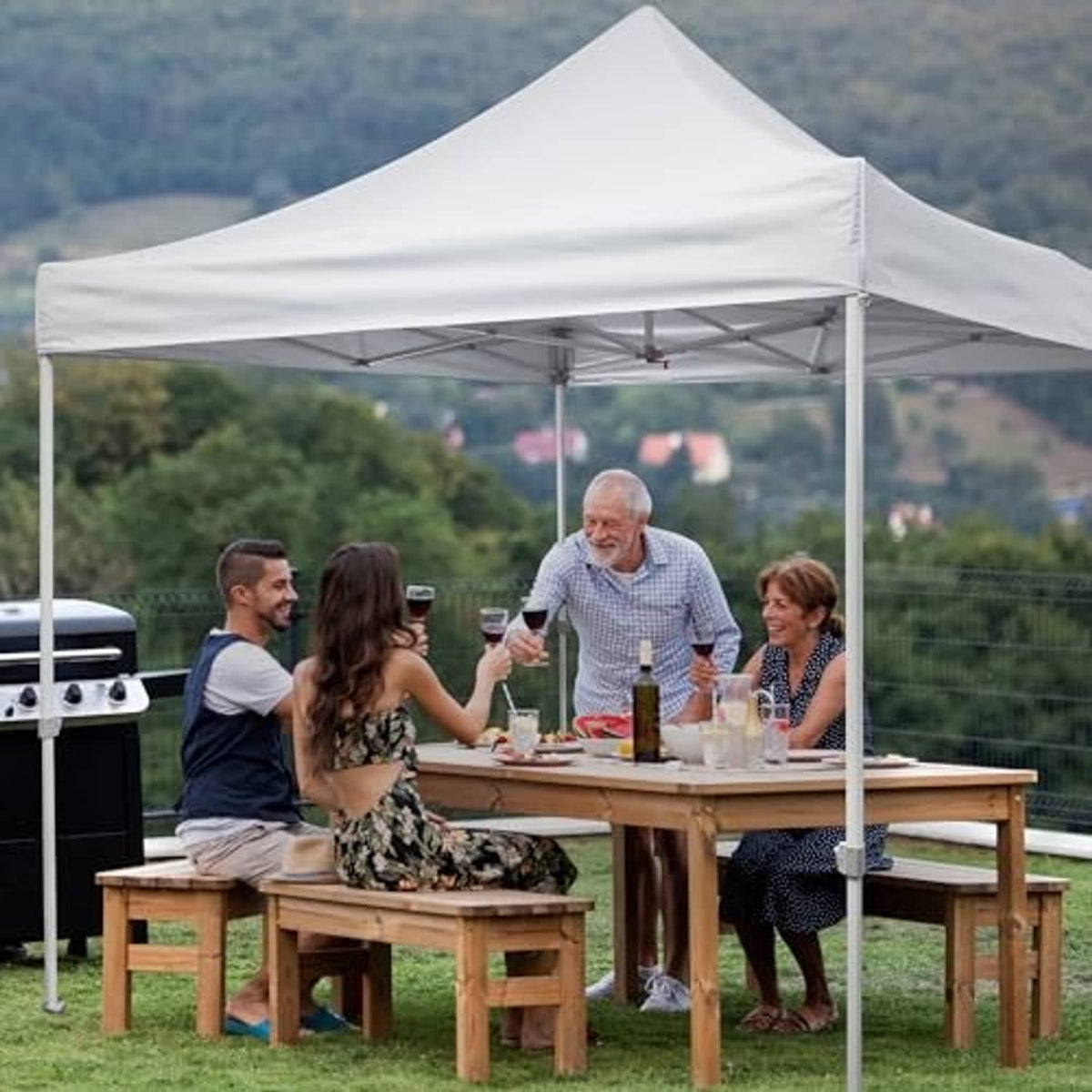 White pop-up tent canopy replacement top over a dining table in outdoor setting