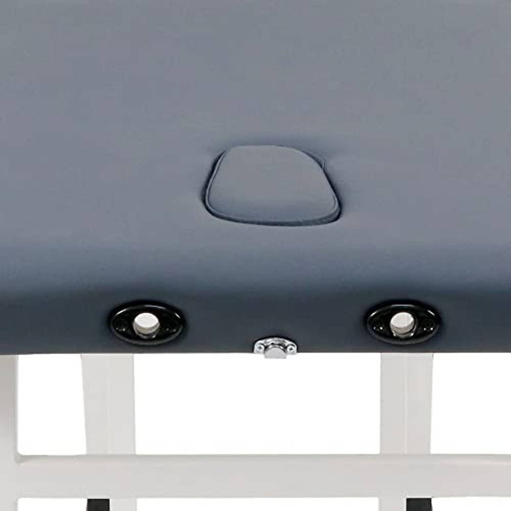 Close-up of royal blue massage table upholstery with headrest handle and metal hardware