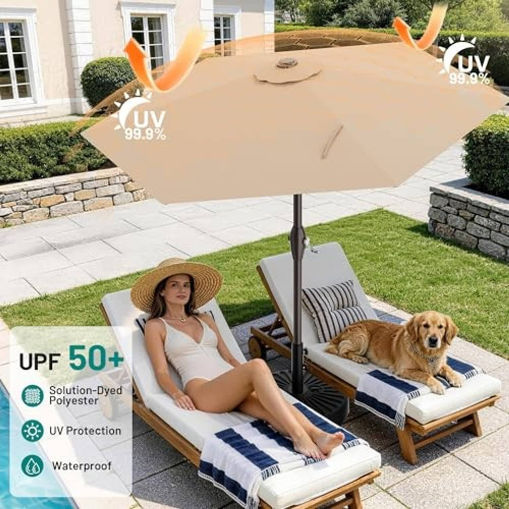 Beige outdoor umbrella over lounge chairs with person and dog in yard