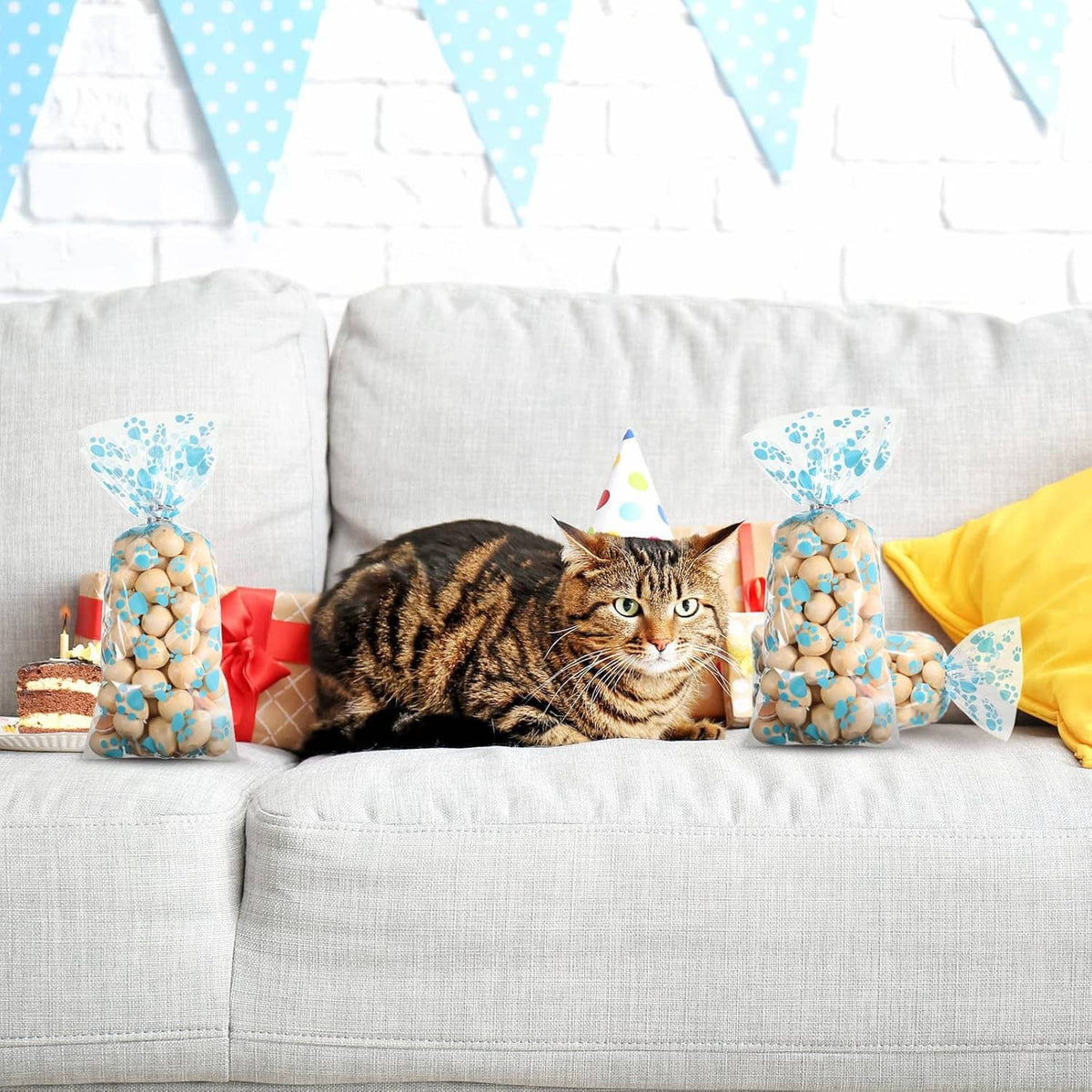 Blue and tan paw-print dog treat cellophane bags with crimped ends and bow ties