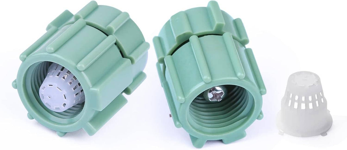 Pair of mint green sprinkler bubbler heads with open nozzle showing spray outlet