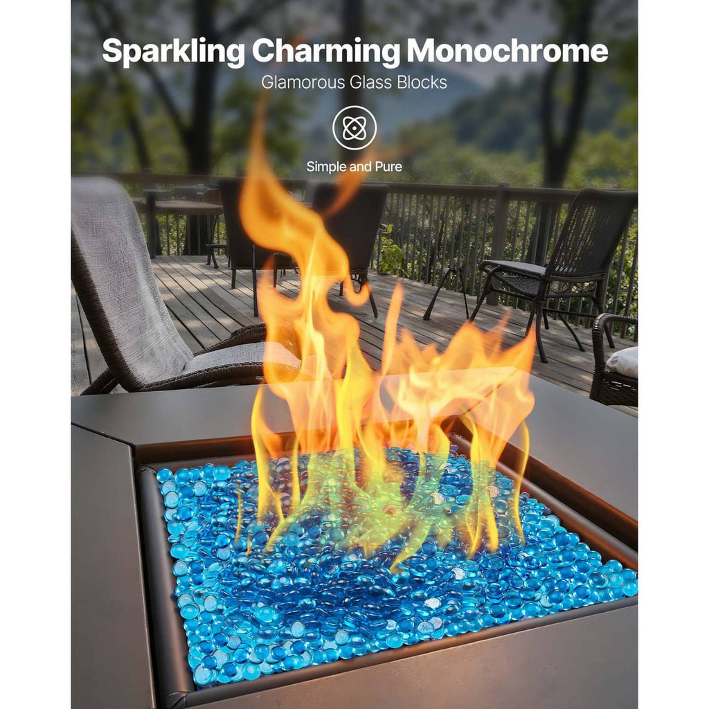 Caribbean blue fire pit glass rocks in a lit outdoor fire pit bed of glass beads