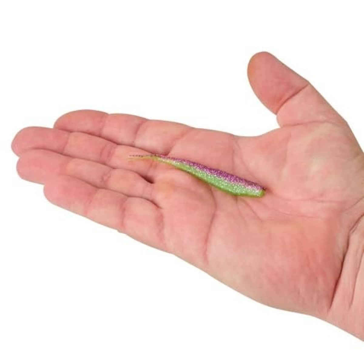 Glitter minnow soft plastic bait in hand, green with purple speckles