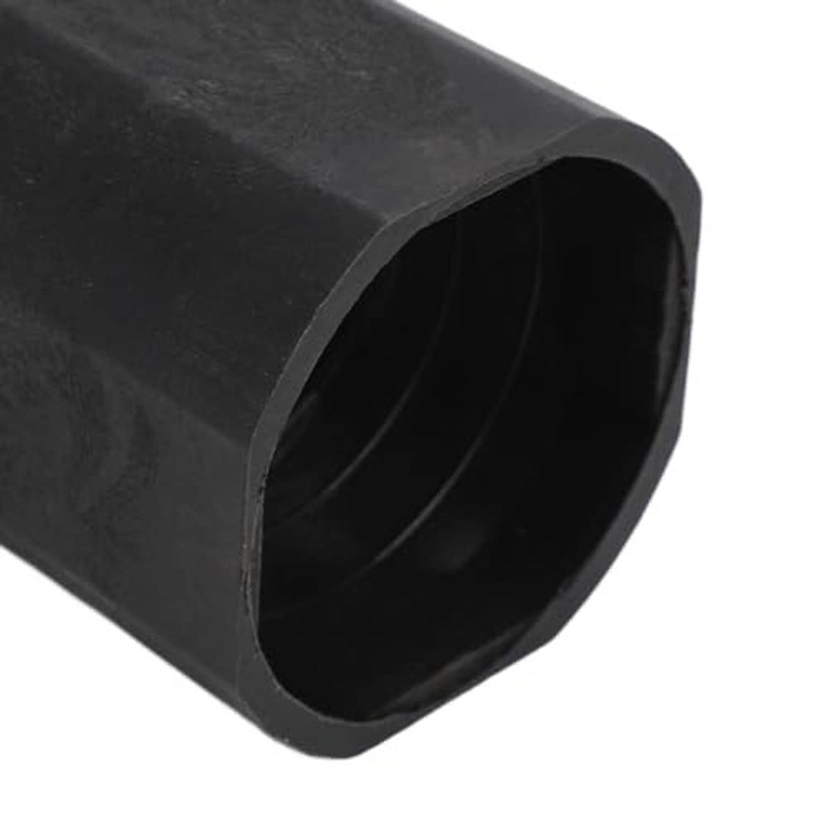 Close-up of black rubber sleeve opening with dark hollow interior
