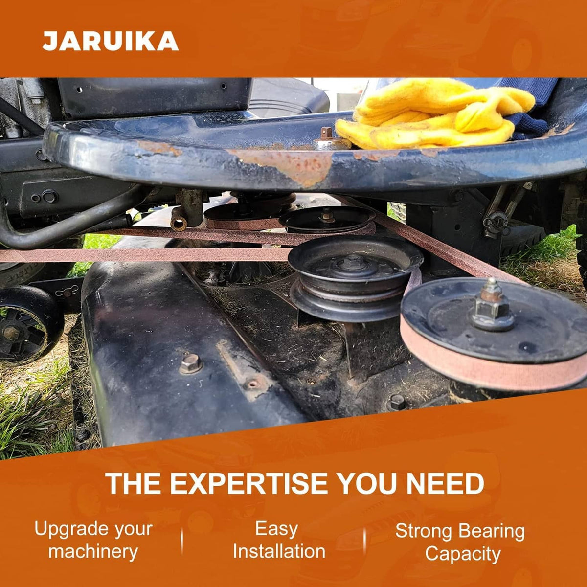 Brown mower deck drive belt installed on mower deck with pulleys