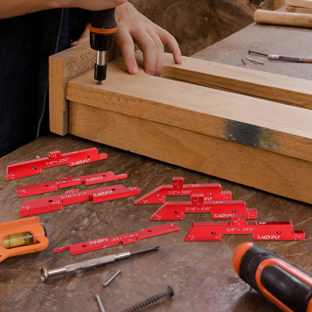 Red aluminum router setup bars and precision blocks on a workbench