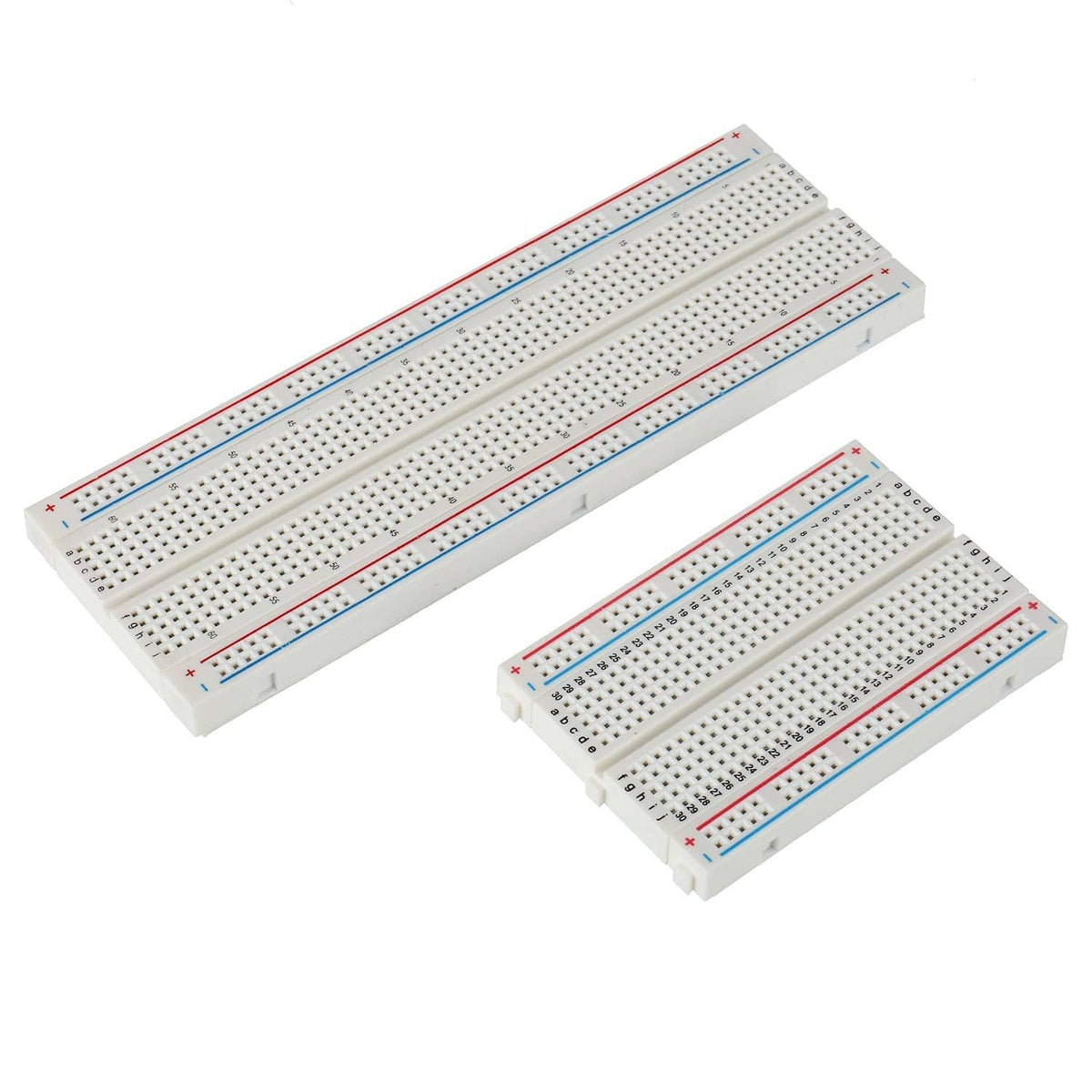 Two solderless breadboards with pin holes, red and blue signal rails