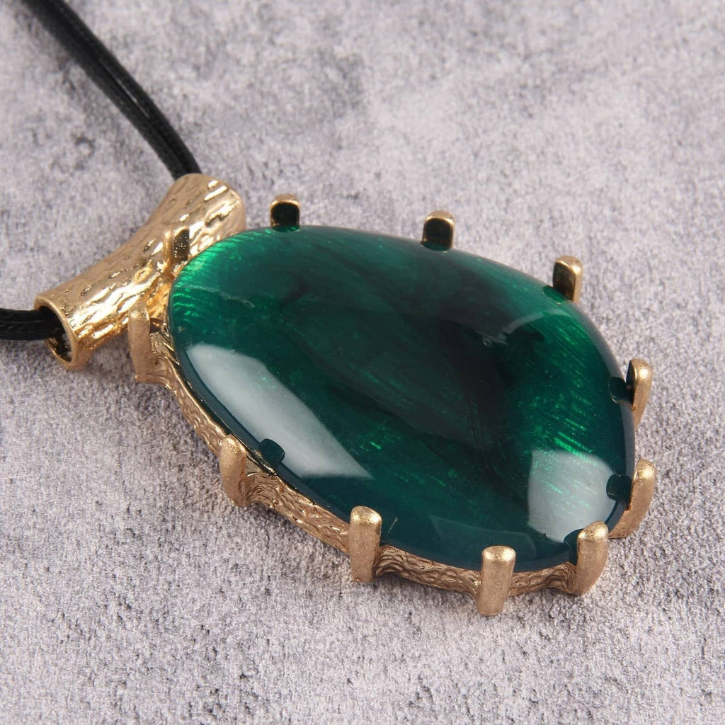 Green teardrop pendant with gold textured frame and black faux leather cord