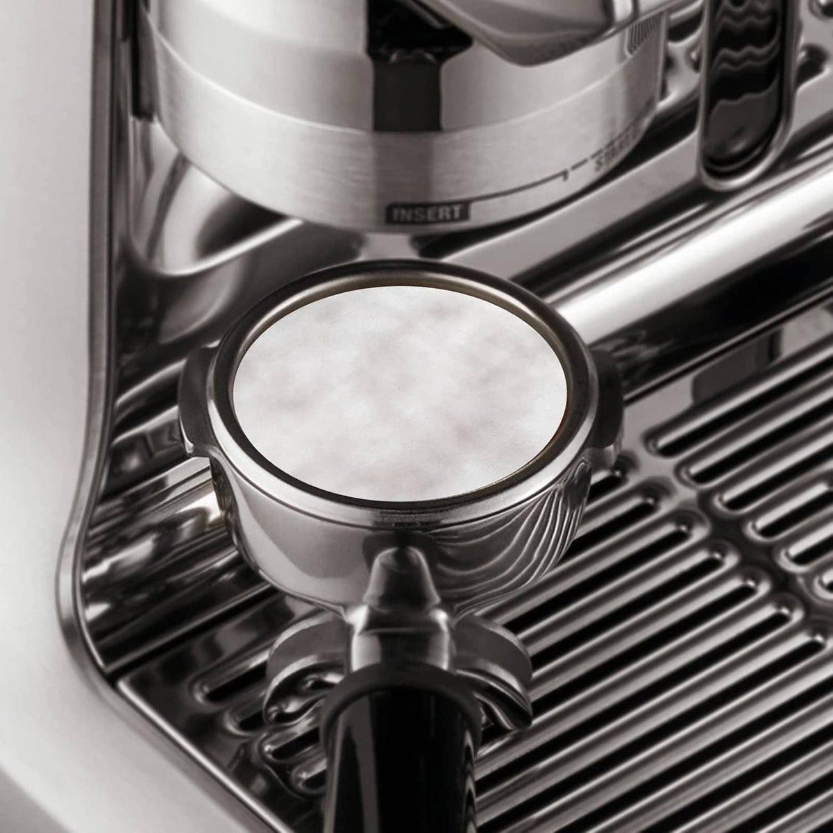 Round paper espresso filter disc in portafilter basket (53–54 mm)