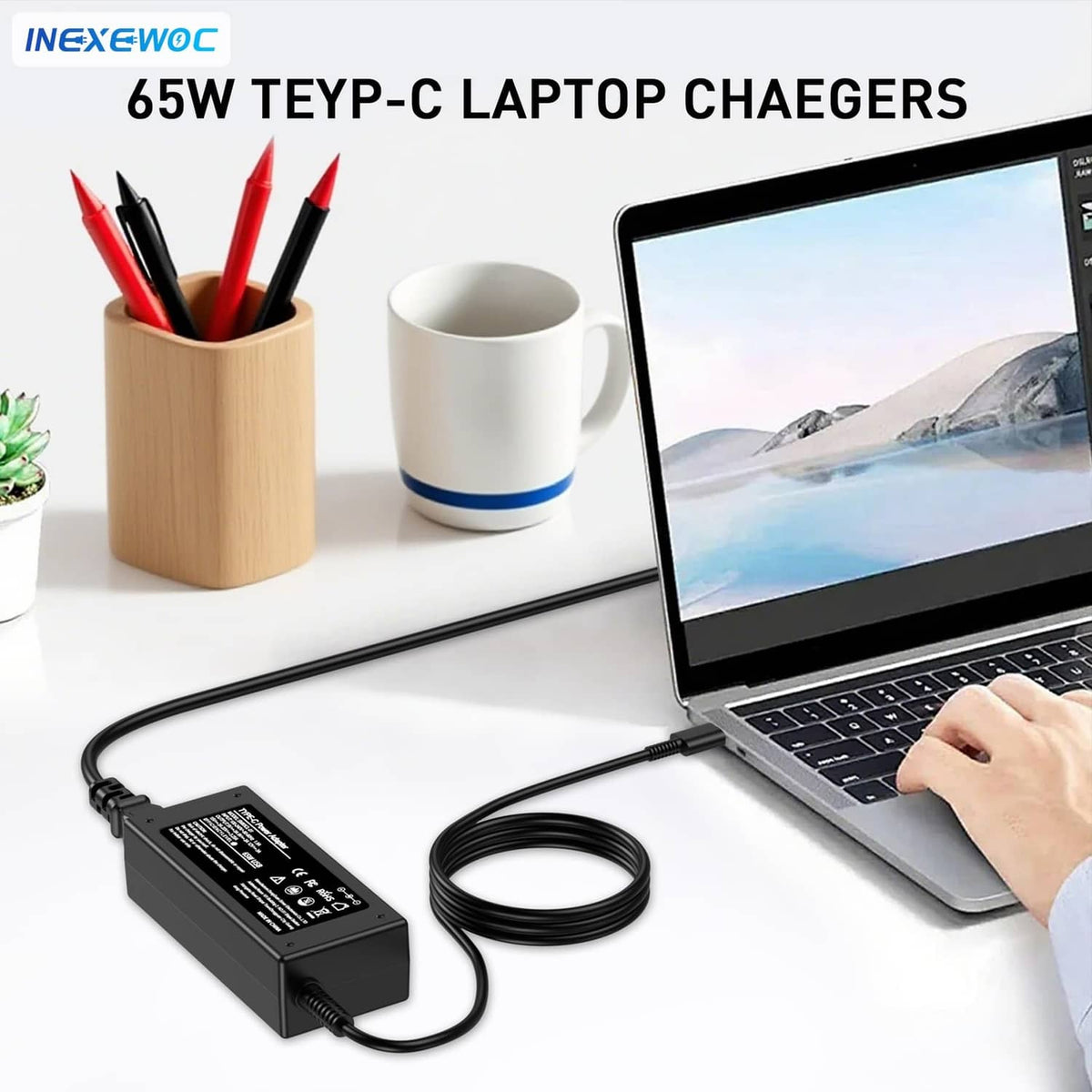 Black 65W USB-C laptop charger connected to USB-C cable on desk