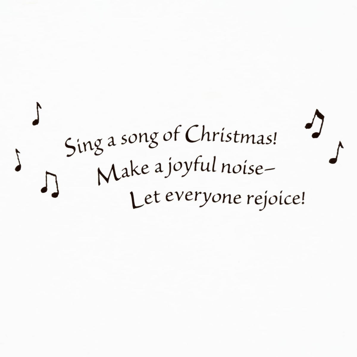 Christmas verse text on a white greeting card: “Sing a song of Christmas!”
