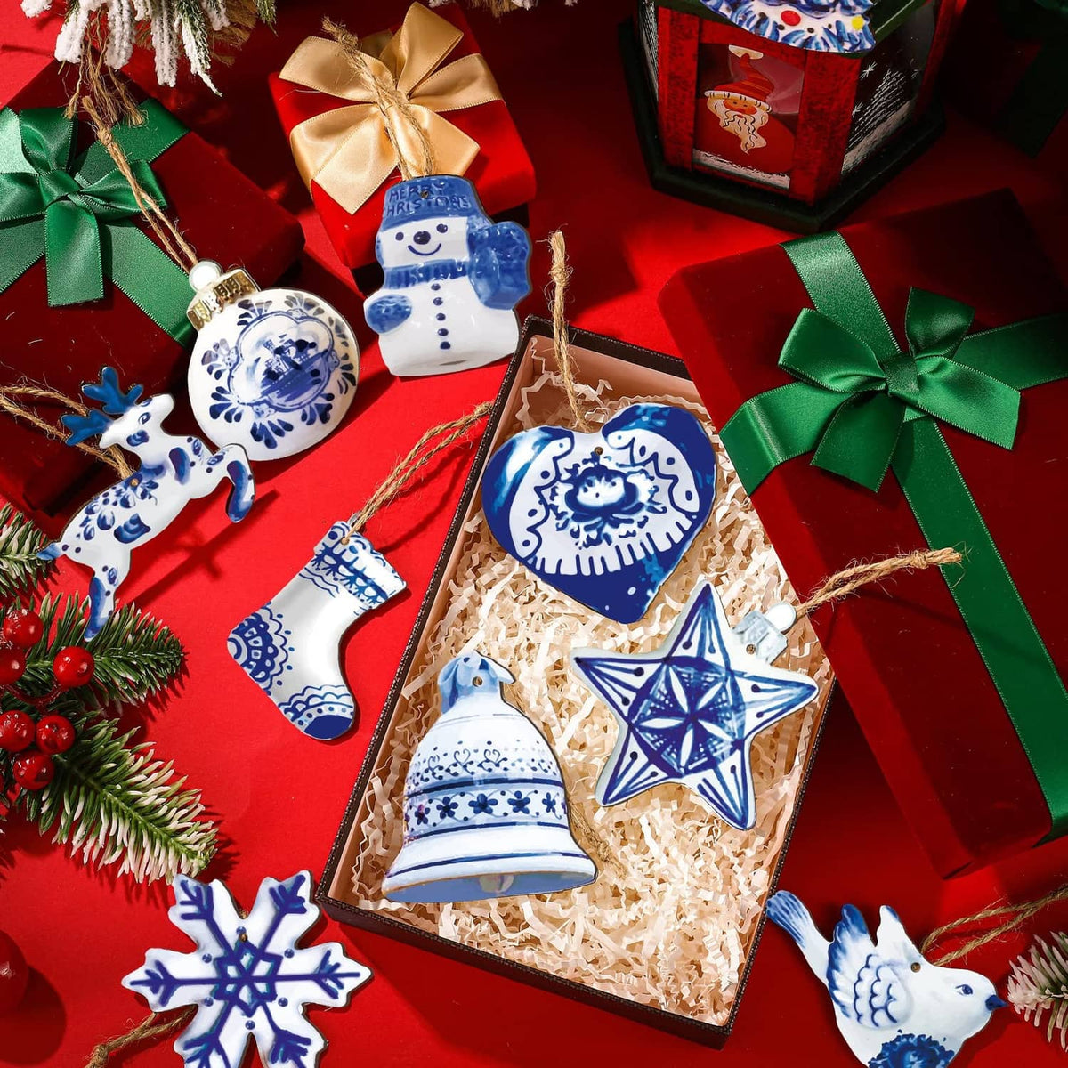 Blue-and-white porcelain Christmas ornaments in gift box: bell, star, heart, snowflake.