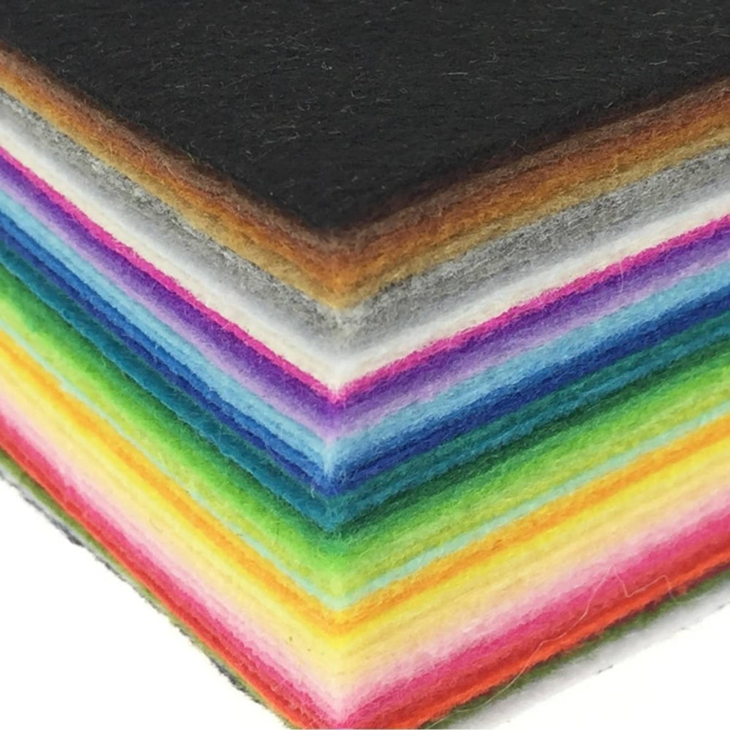 Close-up of layered rainbow felt fabric sheets with visible textured edges