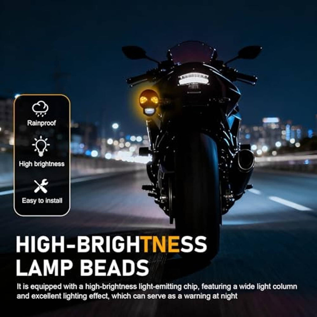 Motorcycle-mounted skull turn signal lights with amber bulbs and clear lower lenses