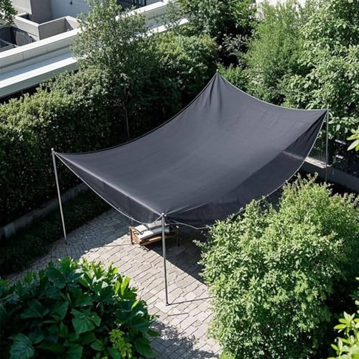 Black shade cloth mesh tarp canopy over yard seating