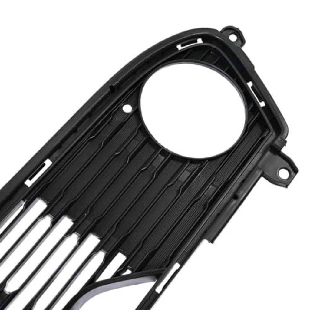 Front bumper lower grille close-up, black with round opening and ribbed slat details