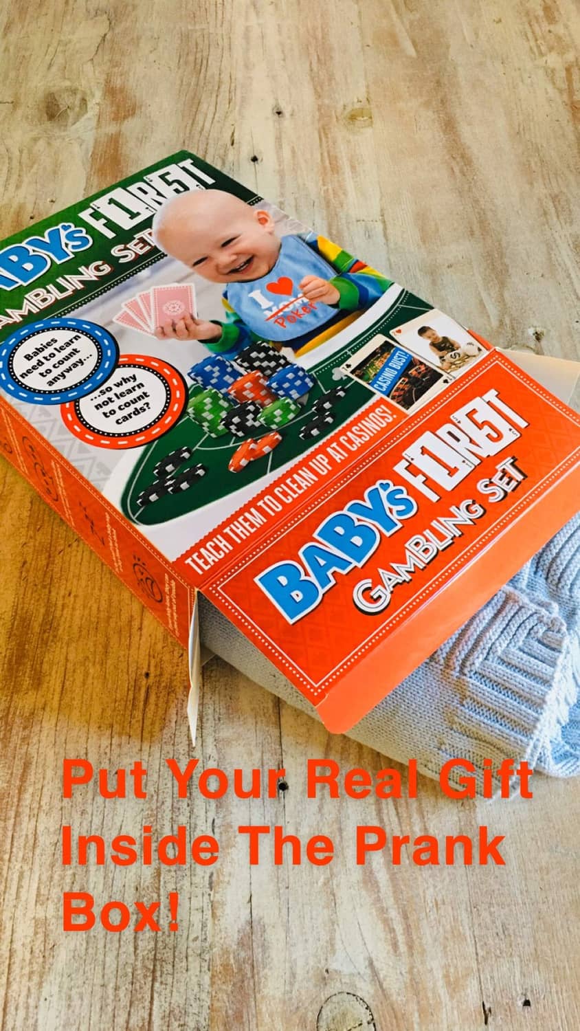 Multicolor prank gift box angled view with baby photo and gambling set artwork