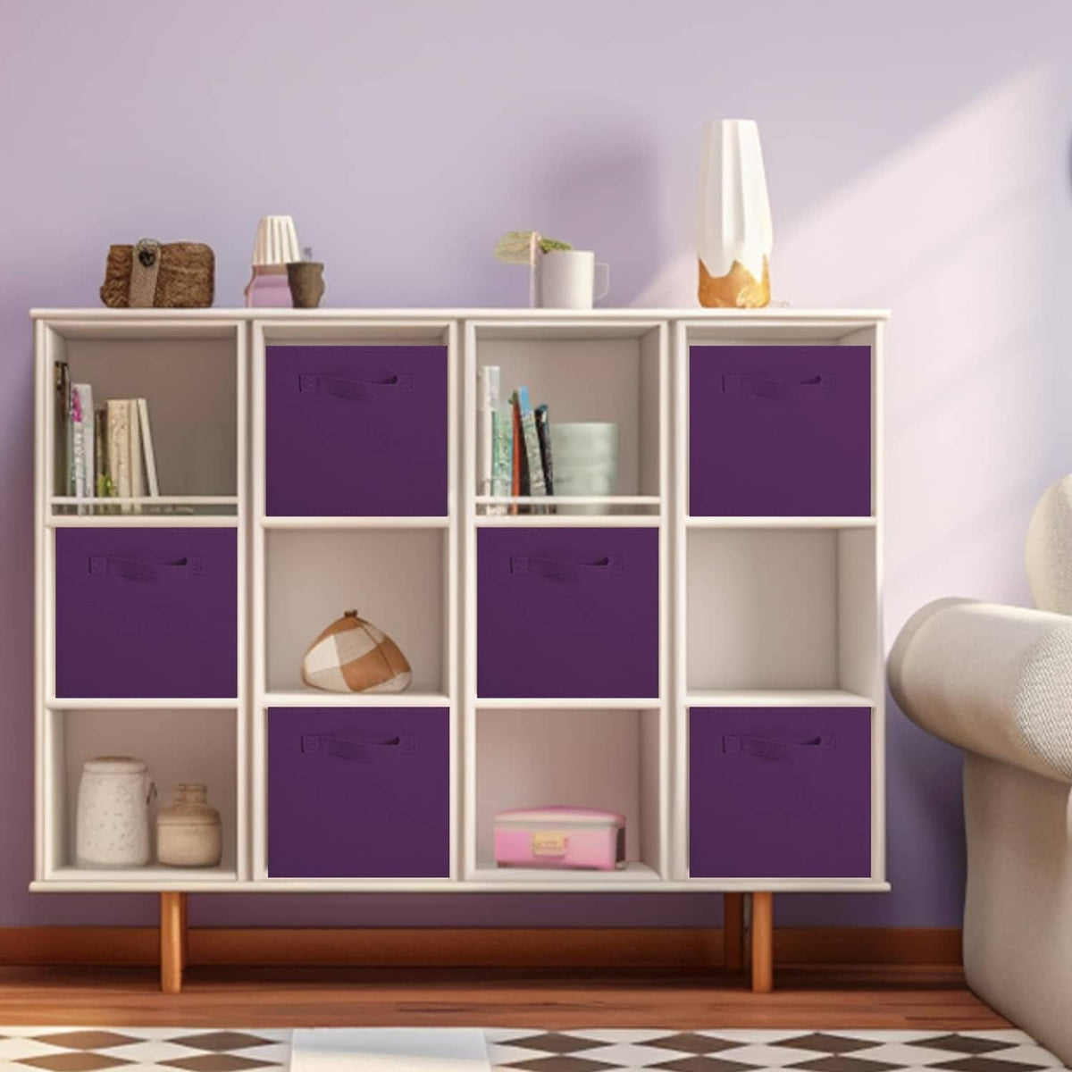 Purple storage cube bins with foldable fabric sides and stitched handles in a cabinet