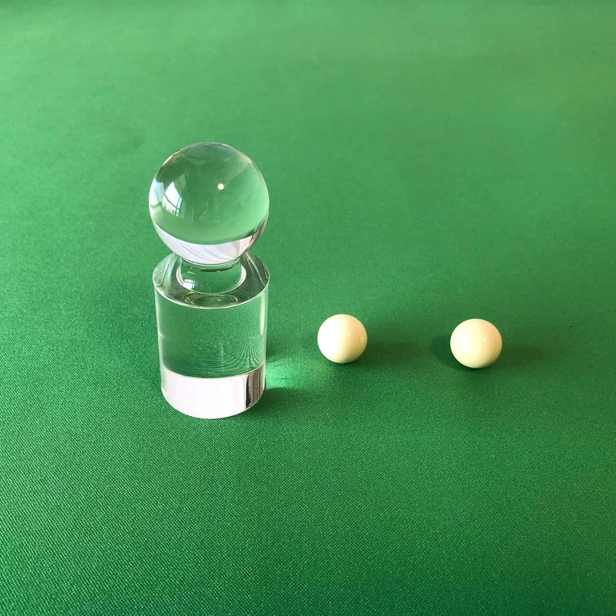 Clear acrylic roulette marker cylinder with round ball top and two pale yellow balls