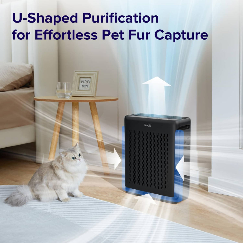 Black air purifier with vented front panel near a pet cat, with airflow arrows.