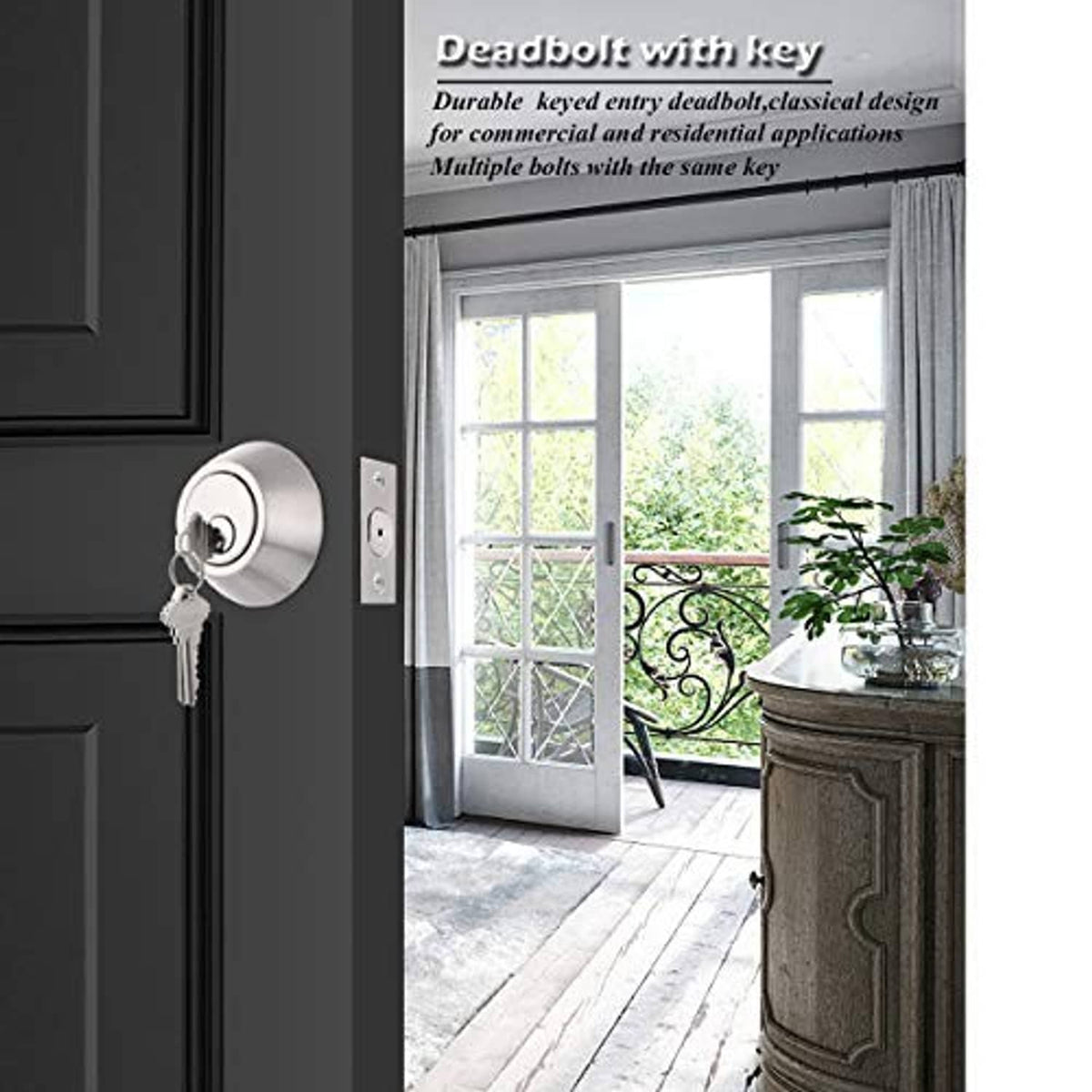 Satin nickel keyed deadbolt lock on a door, with key inserted